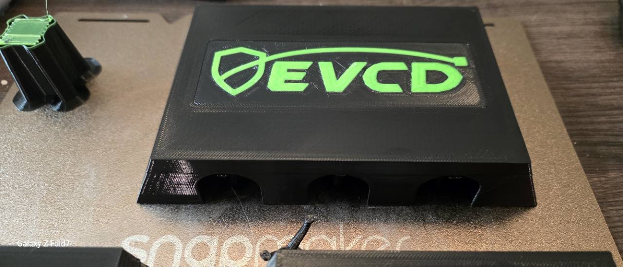 Current EVCD Ridge Trio test print with three channels and the approved green shield-and-cable mark
